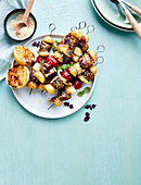 Meat halloumi skewers with tomatoes, potatoes and sesame seeds