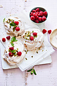 Meringues with pistachio and raspberry chips