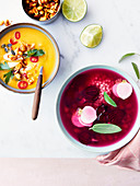 Sweet corn soup with spicy grilled peanuts and beetroot,turnip and tapioca pearl broth