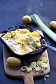Potato and leek gratin with basil cream sauce