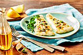 Whiting fillets grilled with herbs and garlic