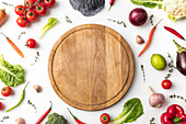 wooden board among vegetables