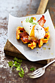 Pumpkin waffle with crisp bacon and poached egg