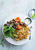 Potato rösti with herbs served with mushrooms, tomatoes and rocket salad