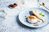 Coconut Blanc Manger with poached pear and speculoos crumbs