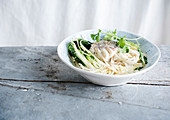 Fillet of white fish with pak choi and noodles (Asia)