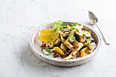 Red rice salad with brussels sprouts, parsnips and orange sauce