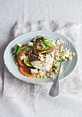 Hake with tomato and courgette rice