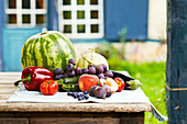 Composition with summer fruit and vegetables outdoors