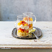 Verrine with sweetcorn, crab meat and peppers in glass cups