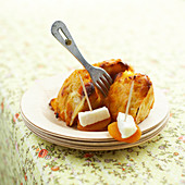 Madeleines with goat's cheese and apricot skewers
