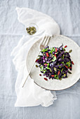 Red cabbage salad with beans and goji berries
