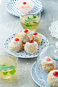 Coconut pastry balls with cherries for tea