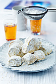 Sesame biscuits dusted with icing sugar