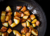 Roast potatoes in a pan