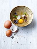 Broth with egg yolk and sesame