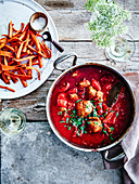 Lamb meatballs cooked with crushed tomatoes and fresh herbs