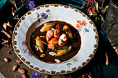 Lobster bisque with potatoes and flaked almonds