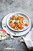 Carrot salad with cashew nuts, spring onions and almond dressing