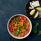 Carrot linguini with tomato sauce, peppers, beans and feta cheese