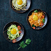 Assorted vegetable spaghetti with fried eggs