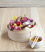 Asian vegetable salad with passion fruit sauce