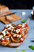 Toasted bread with sun-dried tomatoes and feta cheese