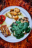 Mushroom pan with spinach and fried potatoes served with tacos and bean ragout