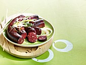 Blood sausages on a green plate