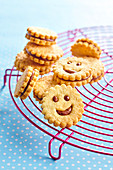 Smiley sandwich cookies with milk chocolate filling