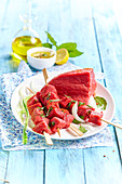 Raw beef skewers for fondue