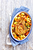 Veal chop roasted in the oven with spring vegetables