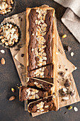 Box-shaped chocolate tart with flaked almonds