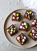 Easter brownies with chocolate ganache and coloured chocolate eggs