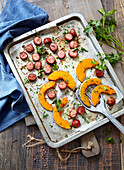 Oven-roasted sausages and squash