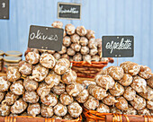 Assortment of sausage products at a market stall