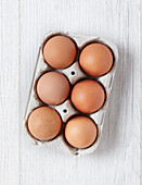 Fresh brown hen's eggs in egg carton