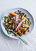 Beef strips with lentils and carrots