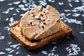 Toast with foie gras, salt and pepper