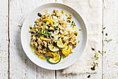 Risotto with yellow and green zucchini and pumpkin seeds