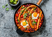 Shakshuka with chicken sausage and fried egg