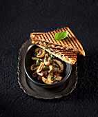 Country bread croque with sheep's cheese and mushrooms
