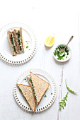 Club sandwich with smoked salmon and fresh herbs