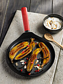 Caramelised banana with pomegranate and coconut yoghurt