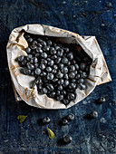 Fresh blueberries in a paper bag