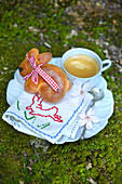 Bunny-shaped Easter rolls with coffee