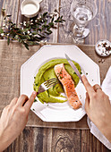 Piece of salmon with green mash