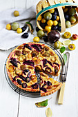 Tart with various plums and almond cream