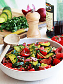 Cucumber and tomato salad with red onions and herbs