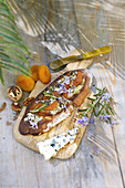 Bruschetta with Roquefort cheese, honey, rosemary and dried apricot